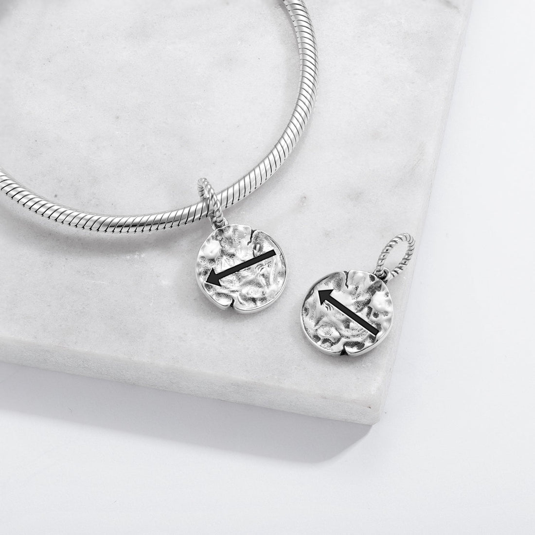 Rock-art-inspired geometric charm