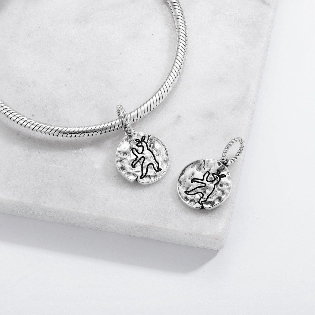 Hare motif charm inspired by folklore and historical animal imagery