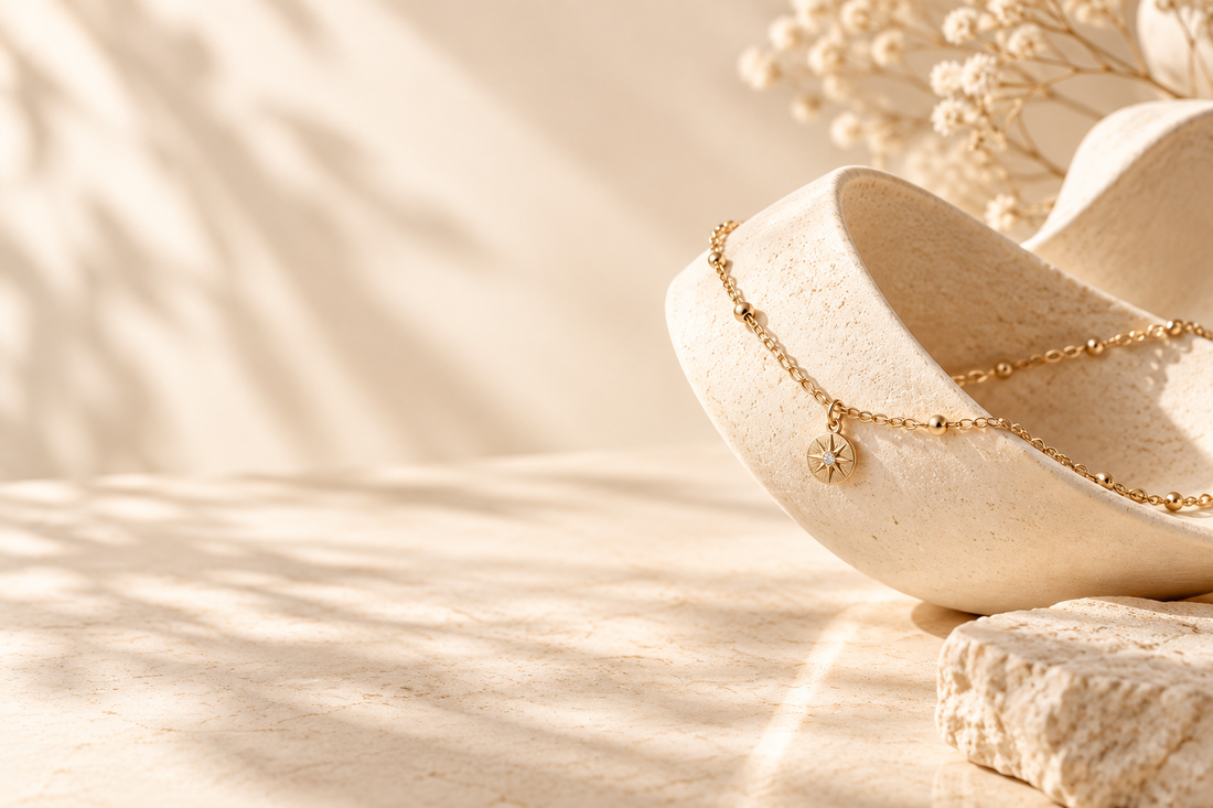 Layered necklace styling on sculptural ivory forms