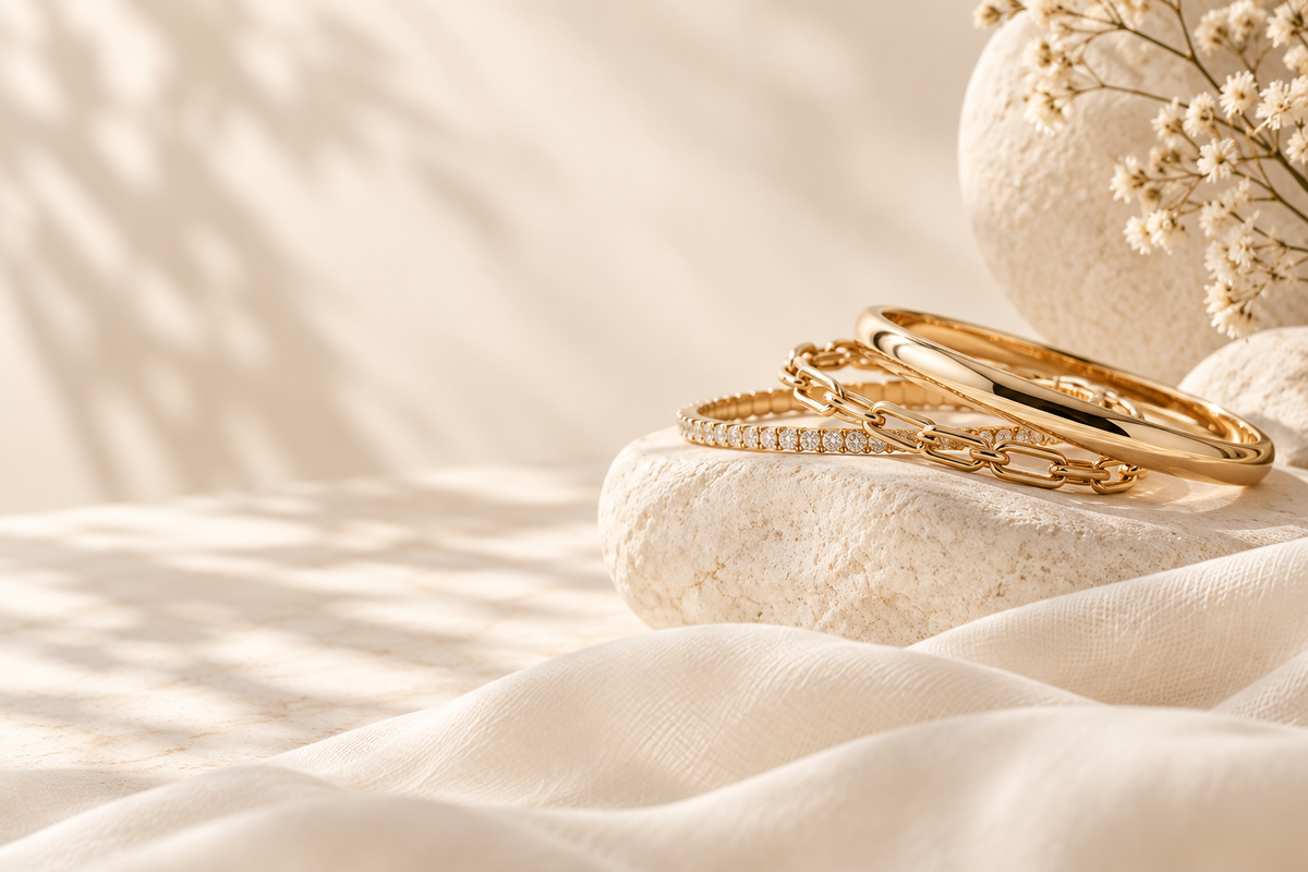 Soft AURYN bracelet still life on warm sunlit stone