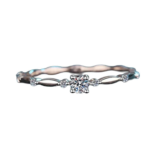 Moissanite solitaire ring in sterling silver on white background