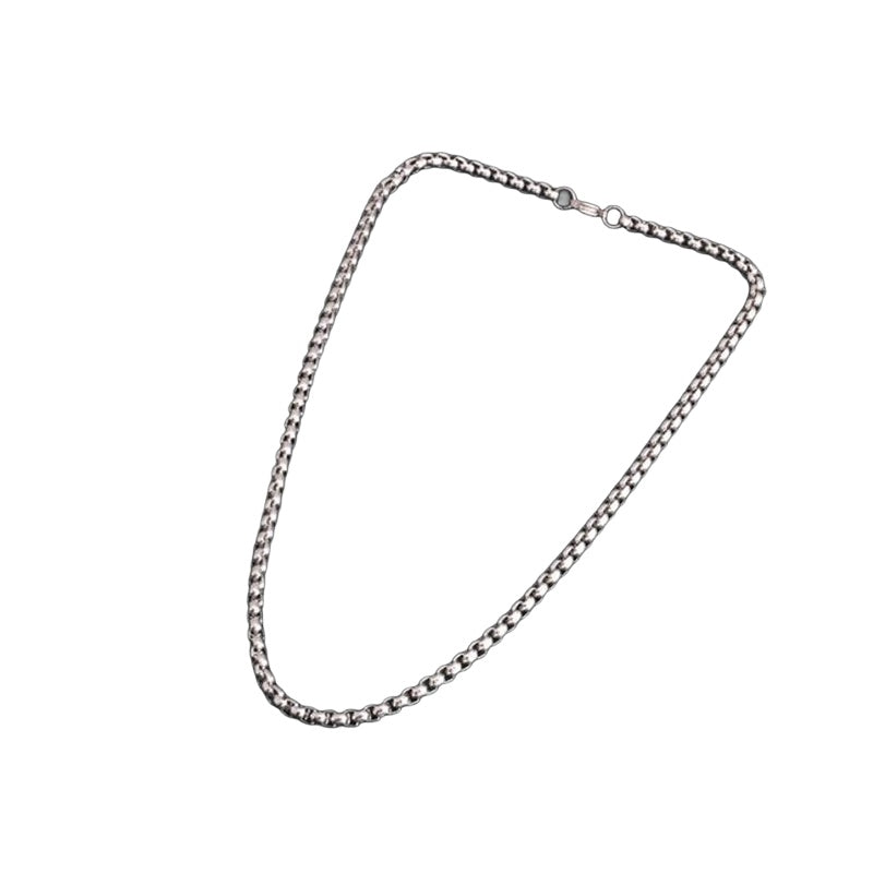 Polished rolo chain necklace on white background