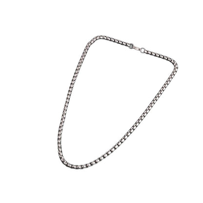Polished rolo chain necklace on white background
