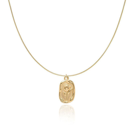 Gold-tone tulip pendant snake chain necklace on a white background