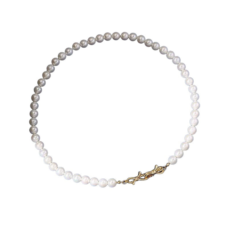 White 8 mm beaded necklace on white background