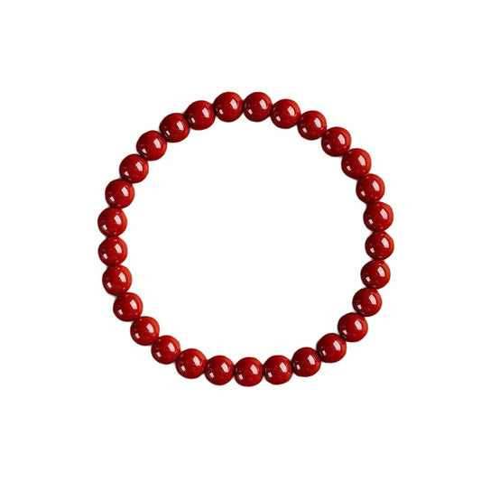 Red cinnabar bracelet 6 mm on white background