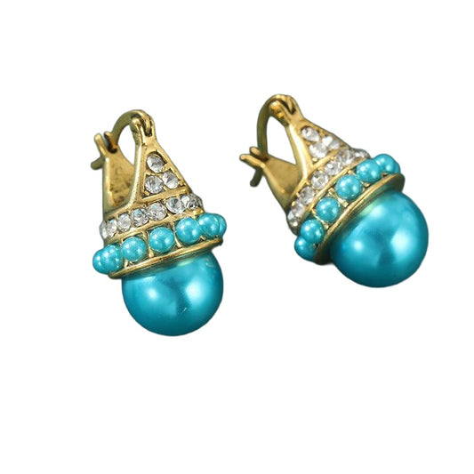 Gold-tone faux pearl bead earrings on white background