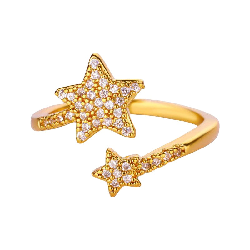 Gold double-star zircon ring on white background