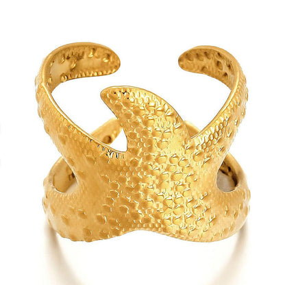 Gold coastal motif open ring on white background