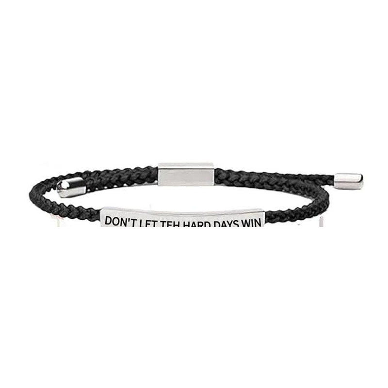 Black woven engraved bracelet on white background
