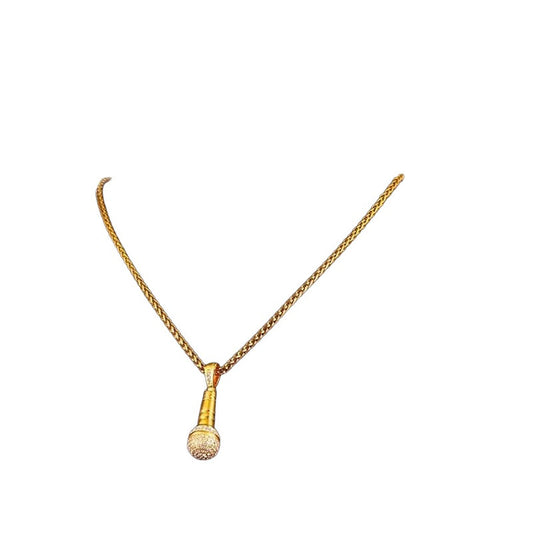 Rhinestone microphone pendant necklace in gold tone on white background