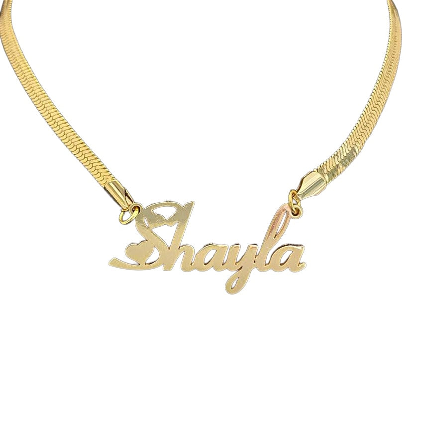 Gold snake chain name necklace on white background