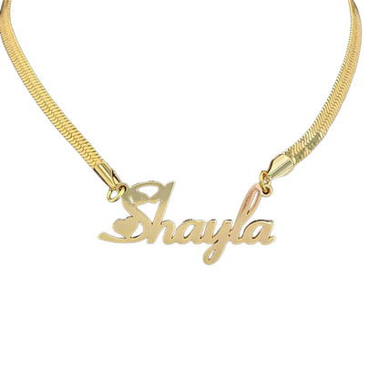 Gold snake chain name necklace on white background