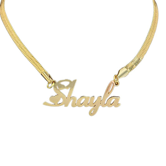 Gold snake chain name necklace on white background